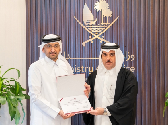 Minister of Justice and Minister of State for Cabinet Affairs  H E Ibrahim bin Ali Al-Mohannadi with a lawyer. 