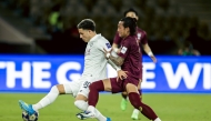 Al Sadd’s Agustín Soria (left) vies for the ball with a Vissel Kobe player during the quarter-final tie.