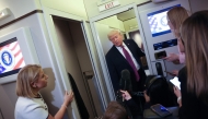 US President Donald Trump speaks to members of the press aboard Air Force One on April 17, 2026 just prior to landing at Joint Base Andrews, Maryland. Win McNamee/Getty Images/AFP