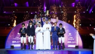 President of Regional Group VII of the International Equestrian Federation Sultan Mohammed Al Yahyai, and Tournament Director Sheikh Talal bin Khalid Al Thani, pose with the podium winners at Al Shaqab. 