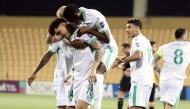 Al Ahli players celebrate during the quarter-final against Al Hussein on Sunday.
