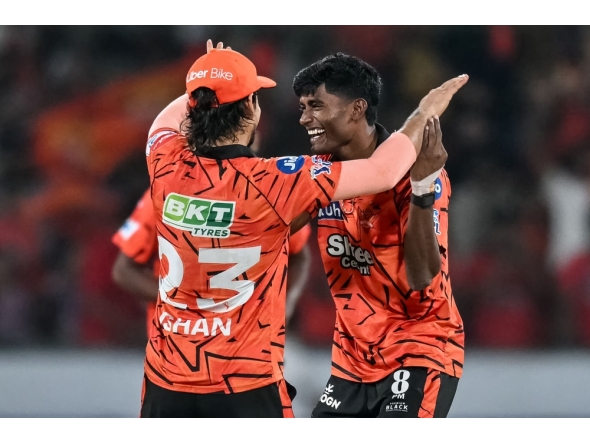 Sunrisers Hyderabad's Indian cricket player Sakib Hussain (R) celebrates with his captain Indian cricket player Ishan Kishan at the Rajiv Gandhi International Stadium in Hyderabad on April 21, 2026. (Photo by Noah Seelam / AFP)