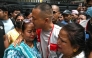Sudan Gurung (C), a key figure among the Gen Z protesters, meets with family members of a victim, who died during anti-corruption clashes with security personnel, outside the Tribhuvan University Teaching Hospital in Kathmandu on September 13, 2025. Photo by Arun SANKAR / AFP