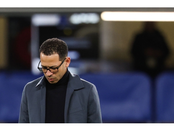 (FILES) Chelsea's English head coach Liam Rosenior looks down ahead of the UEFA Champions League round of 16 second leg football match between Chelsea FC and Paris Saint-Germain (PSG) at Stamford Bridge, west London on March 17, 2026. (Photo by FRANCK FIFE / AFP)