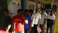 Voters queue to cast their vote outside a polling station during the 2026 Tamil Nadu Legislative Assembly elections in Chennai on April 23, 2026. (Photo by R.Satish BABU / AFP)