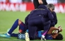 Barcelona's Spanish forward #10 Lamine Yamal receives medical attention after sustaining an injury during the Spanish league football match between FC Barcelona and RC Celta de Vigo at Camp Nou stadium in Barcelona on April 22, 2026. (Photo by Josep Lago / AFP)