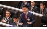 People's Party leader Natthaphong Ruengpanyawut (centre) speaks at the parliament chamber in Bangkok on Apr 9, 2026. (File photo: AFP/Chanakarn Laosarakham)