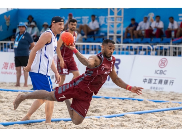 A Qatar player shoots to score during match against Mongolia.