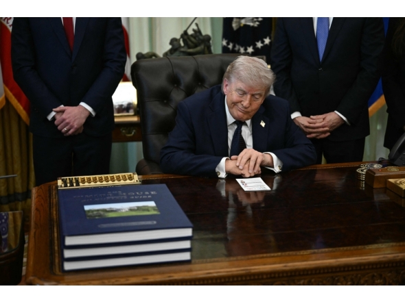 US President Donald Trump gestures during a meeting at the White House in Washington, DC on April 23, 2026. (Photo by Brendan Smialowski / AFP)