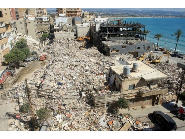 Diggers remove the rubble of buildings destroyed in Israeli strikes as they look for survivors buried underneath in the southern Lebanese coastal city of Tyre on April 21, 2026. Photo by Mahmoud Zayyat / AFP