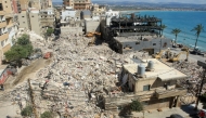 Diggers remove the rubble of buildings destroyed in Israeli strikes as they look for survivors buried underneath in the southern Lebanese coastal city of Tyre on April 21, 2026. Photo by Mahmoud Zayyat / AFP