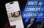 This illustration photo taken in Los Angeles shows a phone with a Truth Social post by US President Donald Trump displaying an image of the alleged suspect in a shooting incident at the White House Correspondents’ Dinner on the ground after being apprehended on April 25, 2026. (Photo by Chris Delmas / AFP)