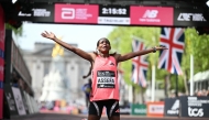 ATHLETICS-GBR-MARATHON
Ethiopia's Tigst Assefa reacts after crossing the line to win the women's race in a new women's only world record at the 2026 London Marathon in central London on April 26, 2026. 
(Photo by JUSTIN TALLIS / AFP) /