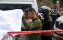 Relatives identify one of the victims after a bomb attack at El Tunel, on the Popayan-Cali road, in Cajibio, Cauca department, Colombia, on April 25, 2026. (Photo by Joaquin SARMIENTO / AFP)