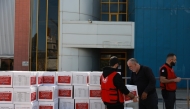 QRCS representatives distributing emergency relief aid to displaced and war-affected families in Beirut.