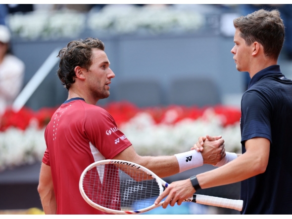 Belgium's Alexander Blockx shakes hands with Norway's Casper Ruud after beating him during their 2026 ATP Tour Madrid Open tennis tournament quarter-final singles match at the Caja Magica in Madrid, on April 30, 2026. (Photo by Thomas COEX / AFP)
