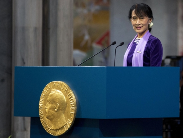 (FILES) Myanmar democracy icon Aung San Suu Kyi delivers her Nobel speech during the Nobel ceremony at Oslo's City Hall on June 16, 2012. (Photo by DANIEL SANNUM LAUTEN / POOL / AFP)