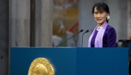 (FILES) Myanmar democracy icon Aung San Suu Kyi delivers her Nobel speech during the Nobel ceremony at Oslo's City Hall on June 16, 2012. (Photo by DANIEL SANNUM LAUTEN / POOL / AFP)