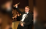 Russian teacher Pavel Talankin hoists his Oscar for Best Documentary Feature Film for 