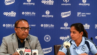 Indian women's cricket captain Harmanpreet Kaur (R) listens to BCCI Secretary Devajit Saikia announcing the squad for the upcoming ICC Women's T20 World Cup and tour of England, in Mumbai on May 2, 2026. (Photo by Indranil MUKHERJEE / AFP)
