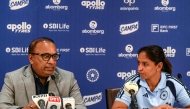 Indian women's cricket captain Harmanpreet Kaur (R) listens to BCCI Secretary Devajit Saikia announcing the squad for the upcoming ICC Women's T20 World Cup and tour of England, in Mumbai on May 2, 2026. (Photo by Indranil MUKHERJEE / AFP)
