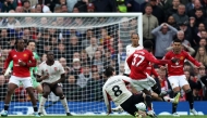 Manchester United's English midfielder #37 Kobbie Mainoo scores the team's third goal during the English Premier League football match between Manchester United and Liverpool at Old Trafford in Manchester, north west England, on May 3, 2026. (Photo by Darren Staples / AFP)
