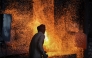 A labourer works at an iron factory in Lahore on April 30, 2026. (Photo by Arif ALI / AFP)
