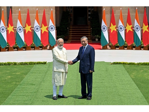 India's Prime Minister Narendra Modi (L) shakes hands with Vietnam's President To Lam before their meeting at the Hyderabad House in New Delhi on May 6, 2026. (Photo by Sajjad Hussain / AFP)