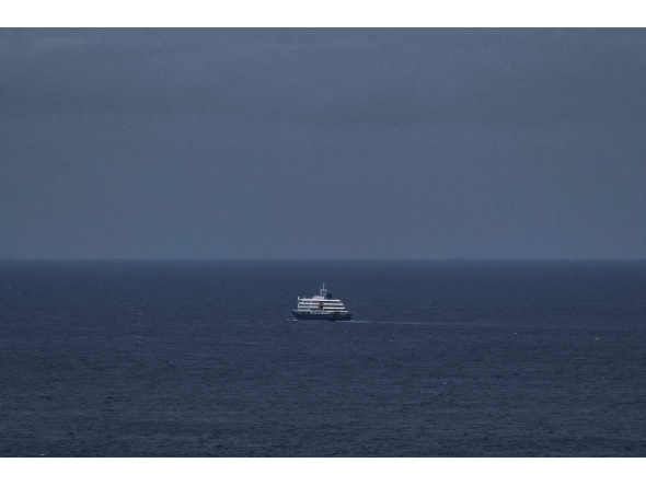 This general view shows the cruise ship MV Hondius, leaving the port of Praia, the capital of Cape Verde, on May 6, 2026. (Photo by AFP)