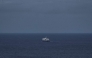 This general view shows the cruise ship MV Hondius, leaving the port of Praia, the capital of Cape Verde, on May 6, 2026. (Photo by AFP)