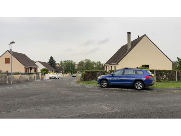 This screengrab made from an AFP video shows a gendarmerie car parked in a street in Fere-en-Tardenois, northern France. (Photo by Noorullah Shirzada / AFP)