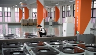A technician checks the quality of mobile robots at Youibot Robotics Co., Ltd. in Hefei, east China's Anhui Province (Xinhua/Zhang Duan)