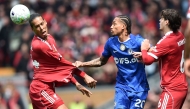 Chelsea's Brazilian striker #20 Joao Pedro pulls on the shirt of Liverpool's Dutch defender #04 Virgil van Dijk during the English Premier League football match between Liverpool and Chelsea at Anfield in Liverpool, north west England on May 9, 2026. (Photo by PETER POWELL / AFP)