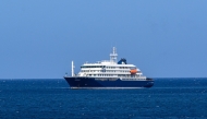 A general view of the cruise ship MV Hondius stationary off the port of Praia, the capital of Cape Verde, on May 3, 2025. Photo by AFP