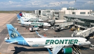 (FILES) Frontier Airlines planes are parked at gates in Denver International Airport (DEN) in Denver, Colorado, on August 5, 2023. (Photo by Daniel SLIM / AFP)
