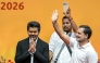 Newly elected chief minister of India's Tamil Nadu state, C. Joseph Vijay (L) along with Indian National Congress (INC) party leader Rahul Gandhi (R) greets supporters after taking the oath during his swearing-in ceremony in Chennai on May 10, 2026. (Photo by R.Satish BABU / AFP)