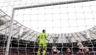 Arsenal's Belgian midfielder Leandro Trossard celebrates scoring the team's first goal past West Ham United's Danish goalkeeper Mads Hermansen during the English Premier League football match between West Ham United and Arsenal at the London Stadium, in east London on May 10, 2026. (Photo by Adrian Dennis / AFP
