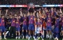 Barcelona's team celebrates winning the 2025-2026 Spanish League after the Spanish league football match between FC Barcelona and Real Madrid CF at Camp Nou Stadium in Barcelona on May 10, 2026. (Photo by Josep LAGO / AFP)