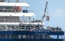 The Dutch flagged hantavirus-stricken cruise ship MV Hondius receives provisions from a boat in the port of Granadilla de Abona on the island of Tenerife in Spain's Canary Islands on May 11, 2026. Photo by JORGE GUERRERO / AFP