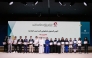Officials with students during the ceremony. 