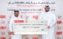 QIIB’s Head of Products Talal al-Jaidah presenting the winner Amer Ali al-Hebshi with a cheque representing the prize amount during a ceremony held at the bank’s headquarters.
