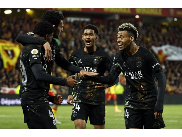Paris Saint-Germain's French forward #49 Ibrahim Mbaye (L) is congratulated by teammates after scoring a goal during the French L1 football match between RC Lens and Paris Saint-Germain (PSG) at the Stade Bollaert-Delelis stadium in Lens on May 13, 2026. (Photo by SIMON WOHLFAHRT / AFP)