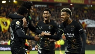 Paris Saint-Germain's French forward #49 Ibrahim Mbaye (L) is congratulated by teammates after scoring a goal during the French L1 football match between RC Lens and Paris Saint-Germain (PSG) at the Stade Bollaert-Delelis stadium in Lens on May 13, 2026. (Photo by SIMON WOHLFAHRT / AFP)