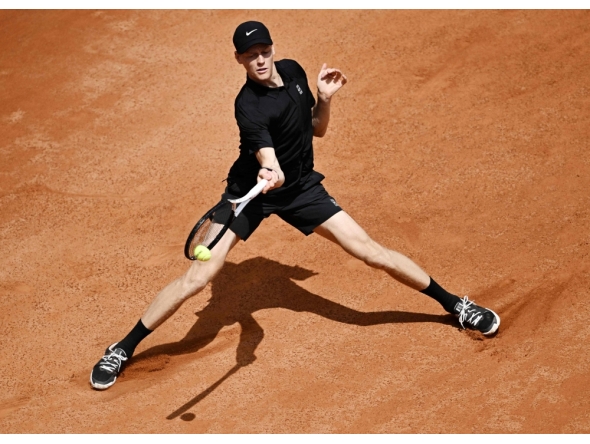 Italy's Jannik Sinner hits a return to Russia's Andrey Rublev during the ATP Rome Open tennis tournament at Foro Italico in Rome (Photo by Tiziana FabiI / AFP)