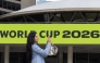 A visitor films the FIFA World Cup 2026-themed decorations at Nathan Phillips Square in Toronto, Canada, on May 11, 2026. (Photo by Zou Zheng/Xinhua)