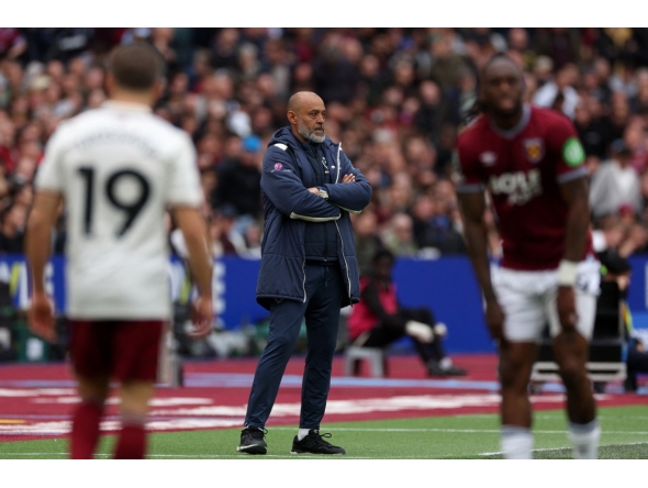 West Ham United's Portuguese head coach Nuno Espírito watches the players from the touchline Santo during the English Premier League football match between West Ham United and Arsenal at the London Stadium, in east London on May 10, 2026. (Photo by Adrian Dennis / AFP)