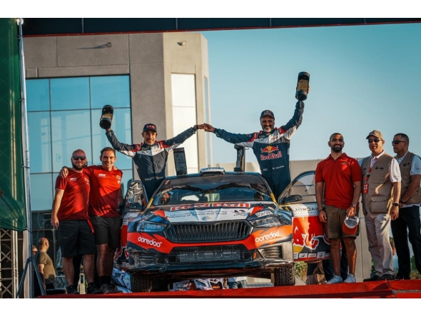 Qatar's Nasser Saleh Al-Attiyah and his Spanish navigator Candido Carrera celebrate with the support crew after winning the 2026 Jordan Rally.