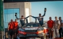 Qatar's Nasser Saleh Al-Attiyah and his Spanish navigator Candido Carrera celebrate with the support crew after winning the 2026 Jordan Rally.