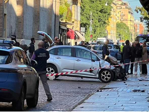 Police work at the scene after a driver injured seven people, two of them badly, when he drove on a sidewalk in Modena on May 16, 2026. (Photo by AFP) 