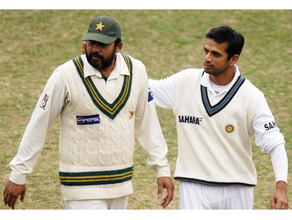 Pakistan's Inzamam-ul-Haq (left) and India's Rahul Dravid leave the ground at close of play on the last day of the first Test match in Lahore, in this January 17, 2006 file photo. AFP